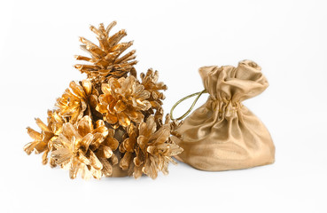Christmas tree of the golden cones and a bag of gifts