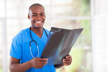 happy young african medical worker with x-ray
