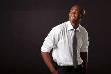 Naklejka premium young african american man over black background