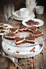Biscuit Cake in the Shape of Heart with Chocolate on Festive Ta