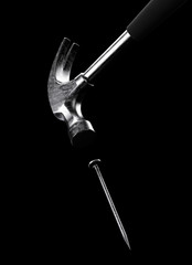 Hummer and Nail isolated on black