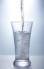 pour clean  water into one glass