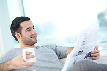 Reading newspaper