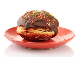 Tasty donut on color plate isolated on white