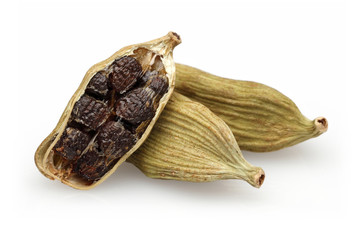 Cardamom seeds on a white background