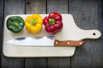 Paprika and knife on cutting board preparation for cooking