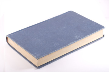 Old blue book isolated on white
