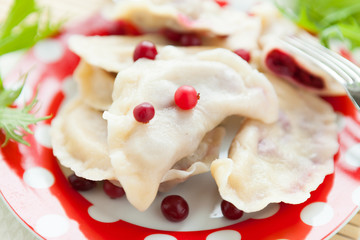 dumplings with cherries, decorated with cranberries