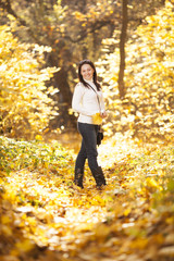 Fashion girl in autumn wood