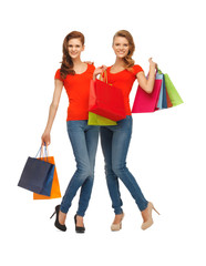 two teenage girls with shopping bags