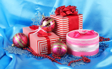Colorful red and pink gifts with Christmas balls, snowflakes