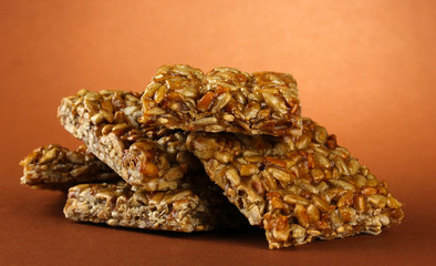 tasty sweets (kozinaki), on brown background