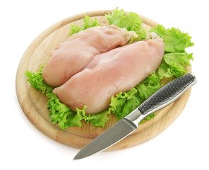 raw chicken meat on cutting board, isolated on white