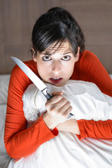 Frightened woman alone at home