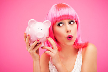 Woman checking her piggy bank