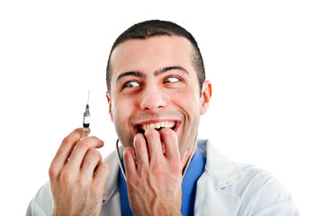 Crazy doctor looking at a syringe - obrazy, fototapety, plakaty