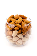 almond  and pistachio nuts in glass container