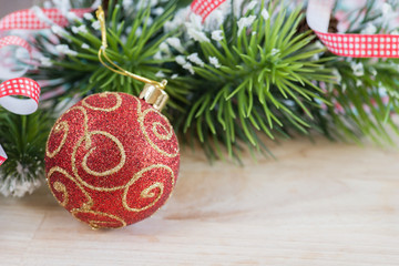 Red christmas ball and fir branches with decorations