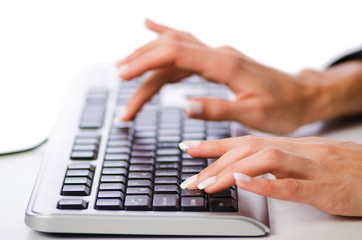 Hands working on the keyboard