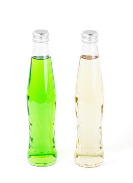 Two lemonade bottles on white