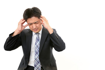 頭痛を訴えるビジネスマン