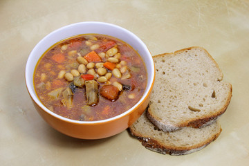 vegetarian stew-goulash soup with soybeans with two slices of b