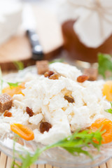 sweet cottage cheese on a plate with dried fruit