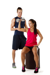 Personal trainer dumbbell lifting