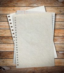 stack of old paper on wood textures background