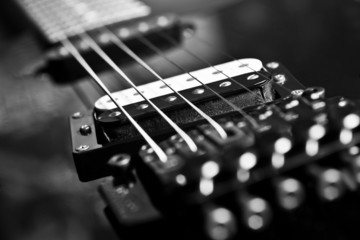 Strings electric guitar closeup in black tones - obrazy, fototapety, plakaty
