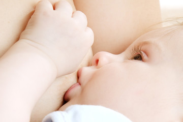 Little baby boy breast feeding