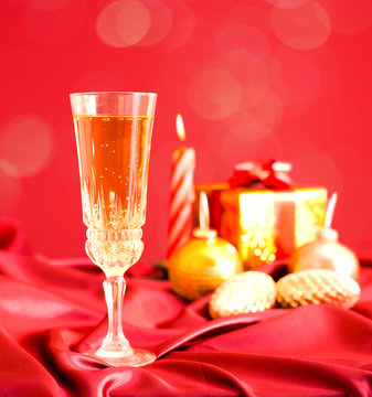 Glass of champagne against Christmas decorations