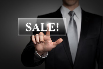 businessman pressing virtual touchscreen button - sale
