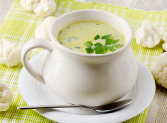 Creamy vegetables soup and cauliflowers