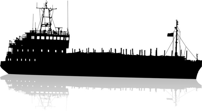 Silhouette of the cargo ship of the barge with fire wood