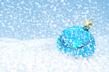 Blue Christmas ball on the snow