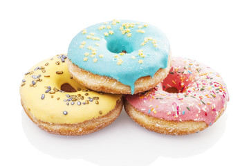 Three glazed donuts isolated on white background