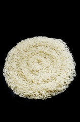 A circle of basmati rice on a black background