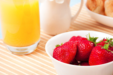 Breakfast with berries,orange juice and croissant