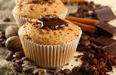 tasty muffin cakes with chocolate, spices and coffee seeds,