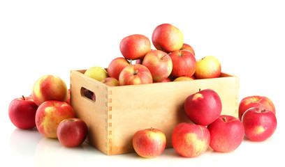 juicy apples in wooden crate, isolated on white