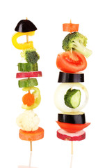 Sliced vegetables on wooden pick isolated on white