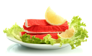 Crab sticks with lettuce leaves and lemon