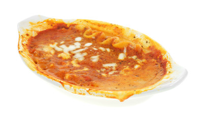 Messy lasagna tv dinner in baking dish