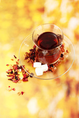 glass of Turkish tea on color background
