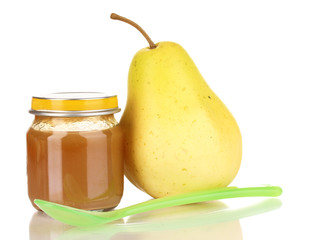 Useful and tasty baby food with pear and spoon isolated on