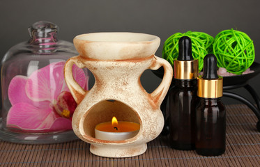 Aromatherapy lamp on grey background