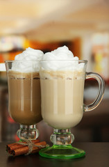 Fragrant coffee latte in glasses cups with vanilla pods,