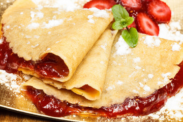 crepes with fresh strawberries and jelly