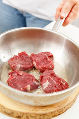 beef steak in a frying pan